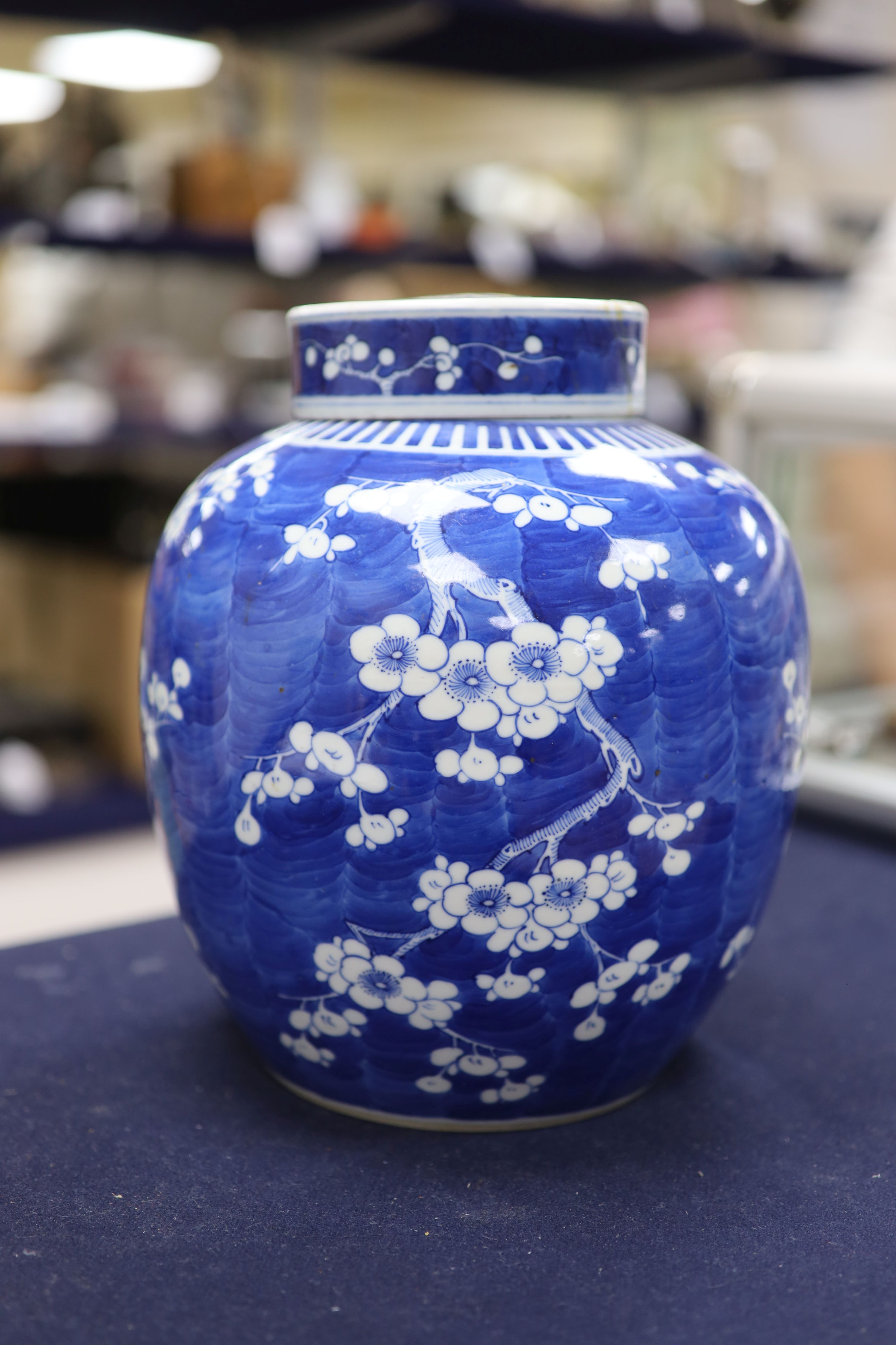 An early 20th century Chinese blue and white prunus jar and cover, height 26cm